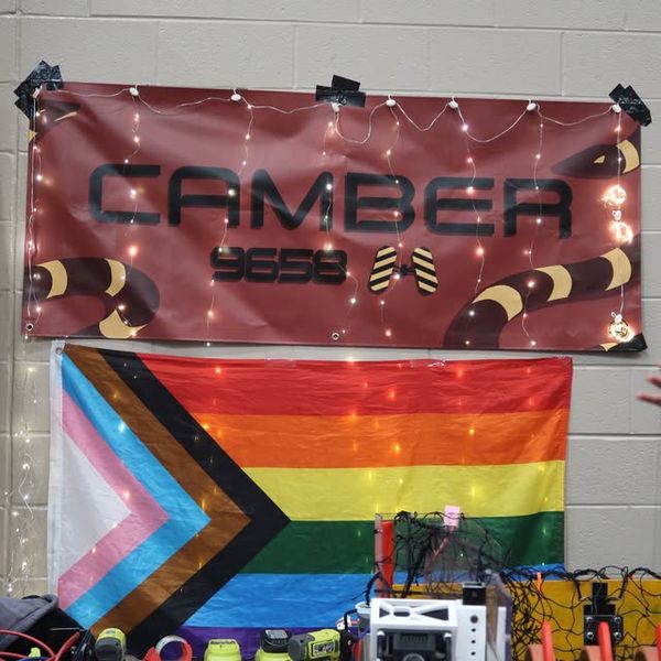 Camber Robotics team banner and pride flag at the team's workspace